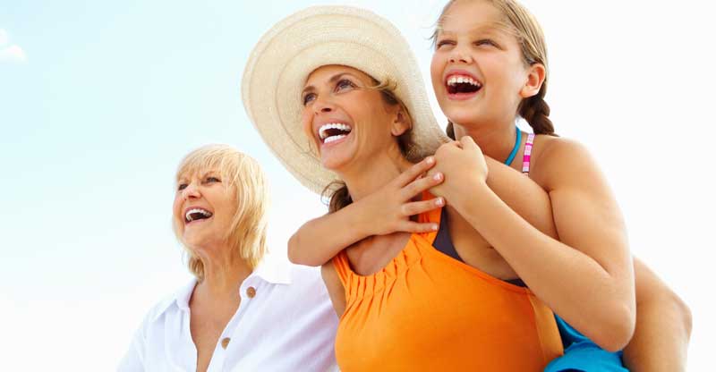 Grandmother, mother and young daughter outside Grandmother, mother and young daughter outside