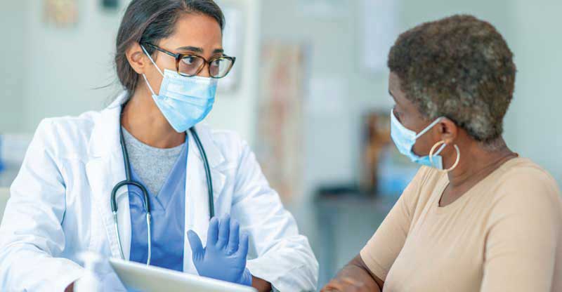 Doctor talking to female patient